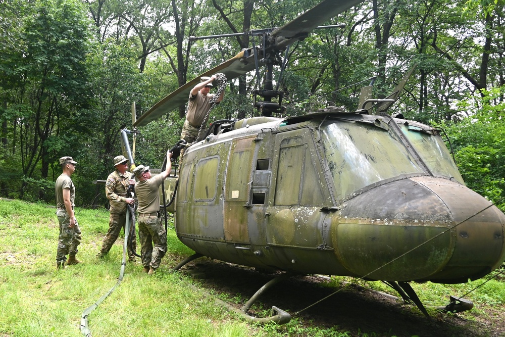 28th ECAB airlifts decommissioned Huey from mountaintop