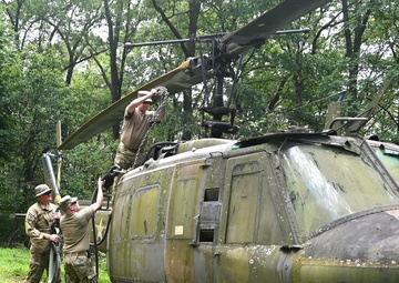 28th ECAB airlifts decommissioned Huey from mountaintop