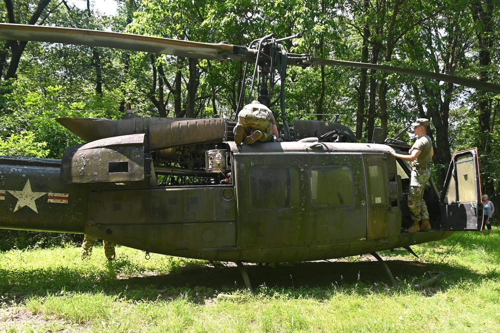 28th ECAB airlifts decommissioned Huey from mountaintop