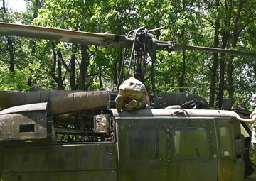 28th ECAB airlifts decommissioned Huey from mountaintop