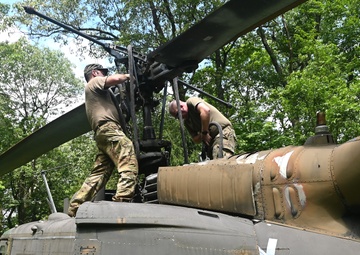 28th ECAB airlifts decommissioned Huey from mountaintop
