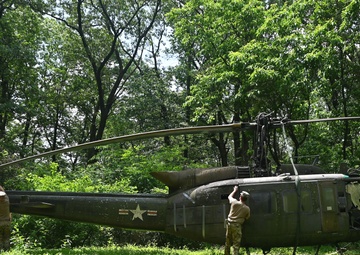 28th ECAB airlifts decommissioned Huey from mountaintop