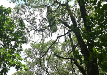 28th ECAB airlifts decommissioned Huey from mountaintop