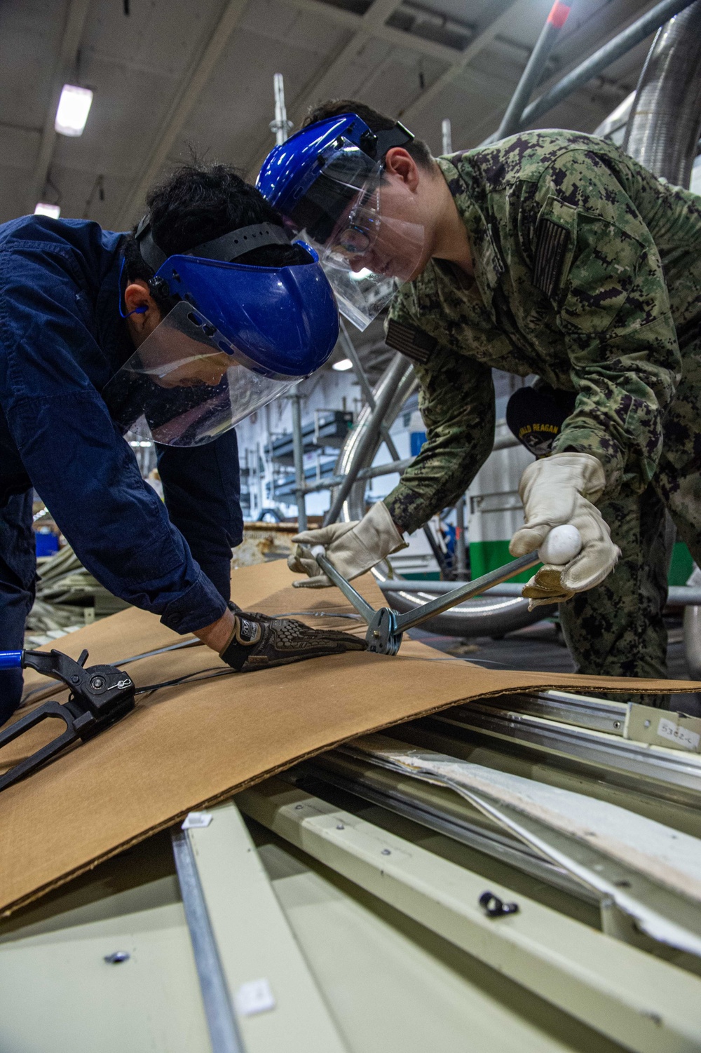 Ronald Reagan Sailors Remove Racks from Berthing