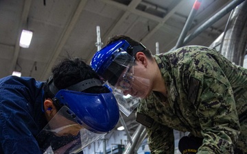 Ronald Reagan Sailors Remove Racks from Berthing