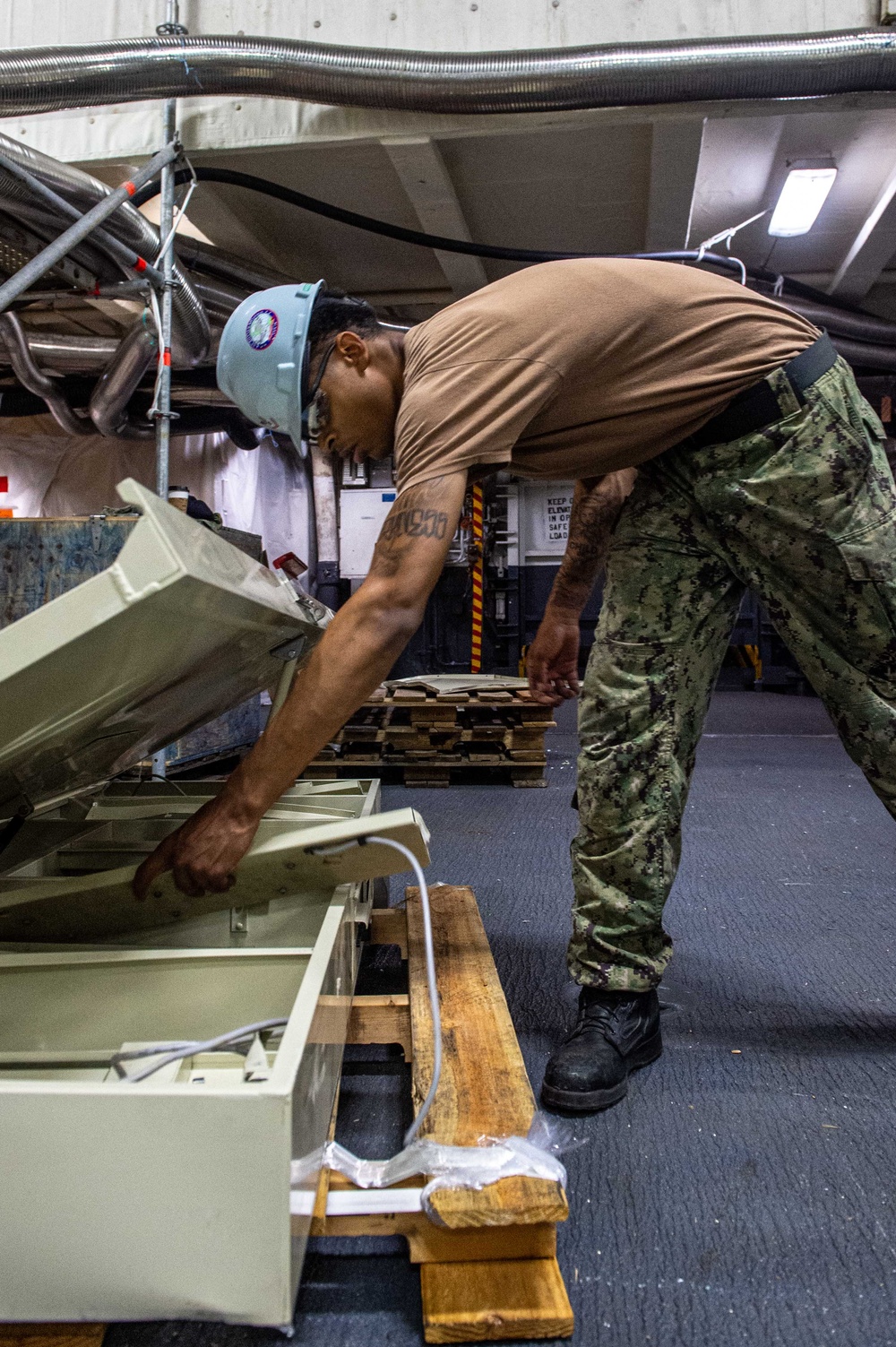 Ronald Reagan Sailors Remove Racks from Berthing