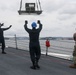 Sailors aboard the USS John Finn conduct an ammo onload in Yokosuka, Japan
