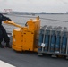 Sailors aboard the USS John Finn conduct an ammo onload in Yokosuka, Japan