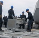 Sailors aboard the USS John Finn conduct an ammo onload in Yokosuka, Japan