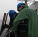 Sailors aboard the USS John Finn conduct an ammo onload in Yokosuka, Japan