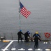 Sailors aboard the USS John Finn conduct an ammo onload in Yokosuka, Japan