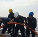 Sailors aboard the USS John Finn conduct a sea and anchor detail in Yokosuka, Japan