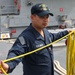 Sailors aboard the USS John Finn conduct a sea and anchor detail in Yokosuka, Japan