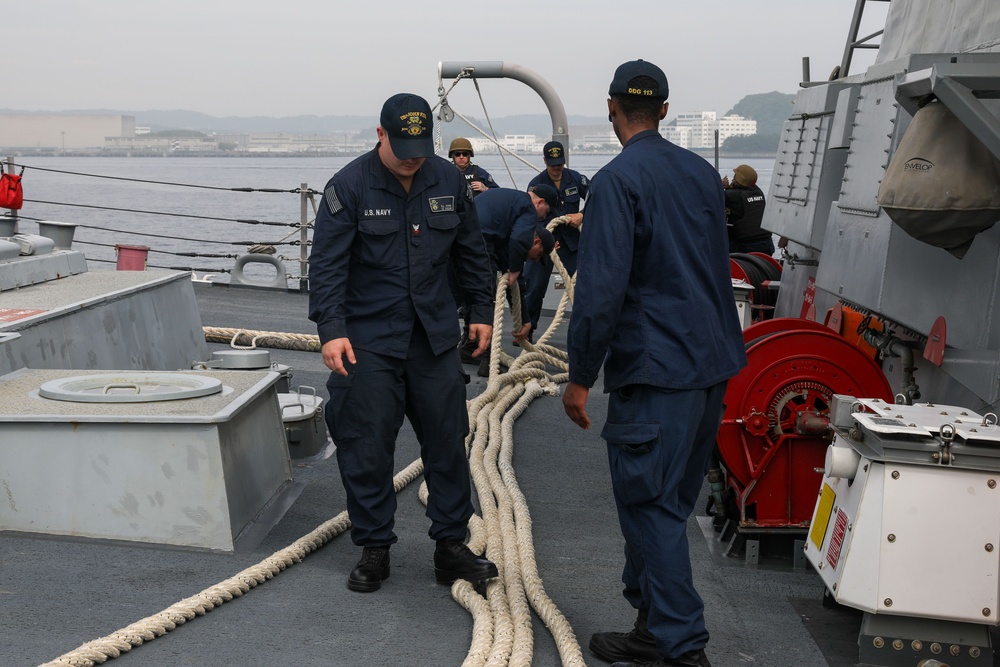 Sailors aboard the USS John Finn conduct a sea and anchor detail in Yokosuka, Japan