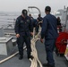 Sailors aboard the USS John Finn conduct a sea and anchor detail in Yokosuka, Japan