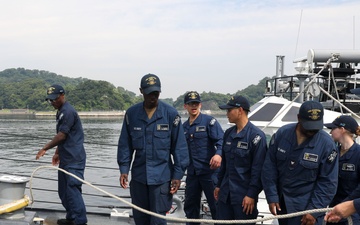 Sailors aboard the USS John Finn conduct a sea and anchor detail in Yokosuka, Japan