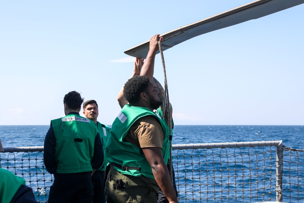 Sailors aboard the USS John Finn conduct flight quarters in Sagami Wan