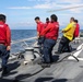 Sailors aboard the USS John Finn conduct flight quarters in Sagami Wan
