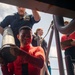 Sailors Reload Chaff Launchers Aboard USS Tripoli