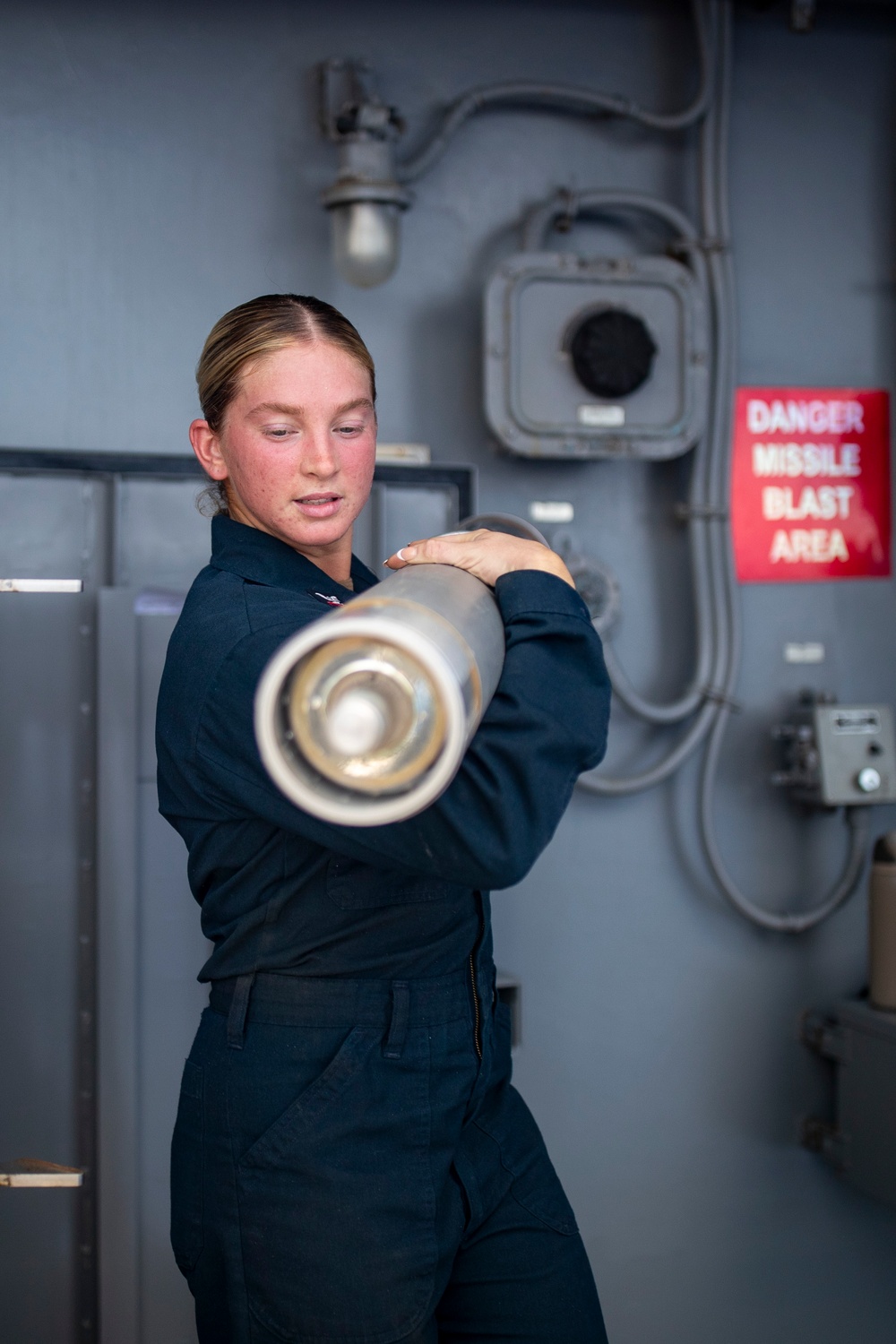 Sailors Reload Chaff Launchers Aboard USS Tripoli