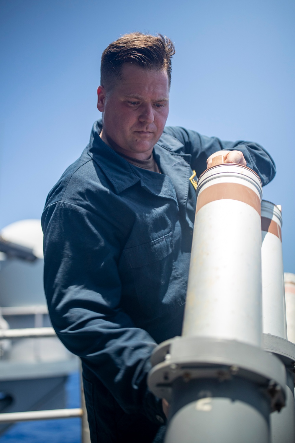 Sailors Reload Chaff Launchers Aboard USS Tripoli
