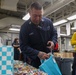 USS Tripoli’s Junior Enlisted Association Honors Tripoli Fathers With Customized Gift Bags