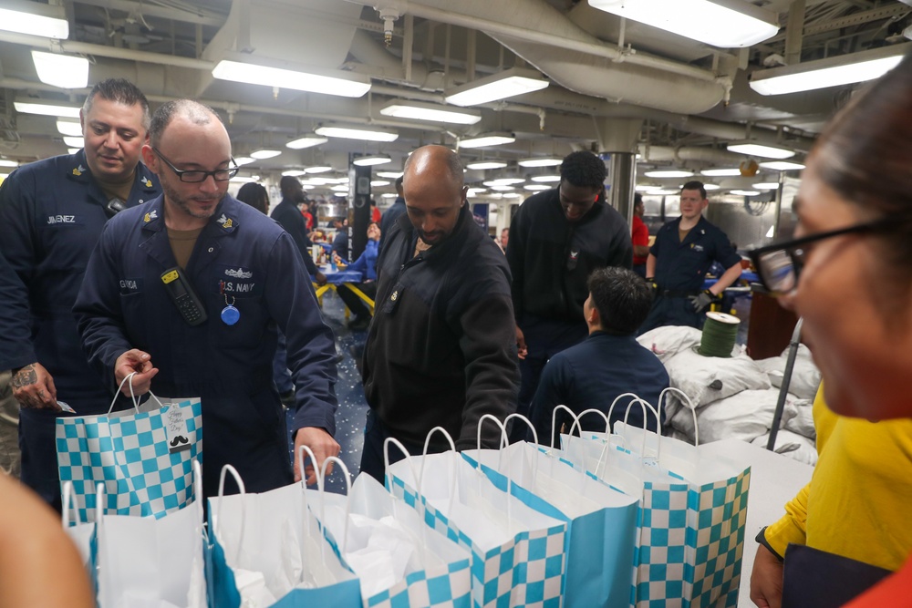 USS Tripoli’s Junior Enlisted Association Honors Tripoli Fathers With Customized Gift Bags