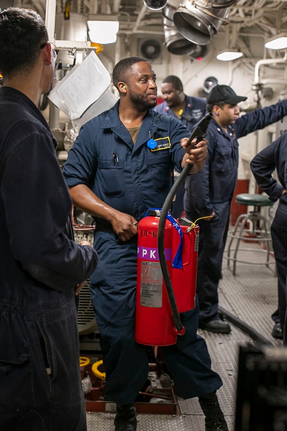 USS Tripoli Conducts Main Space Fire Drill