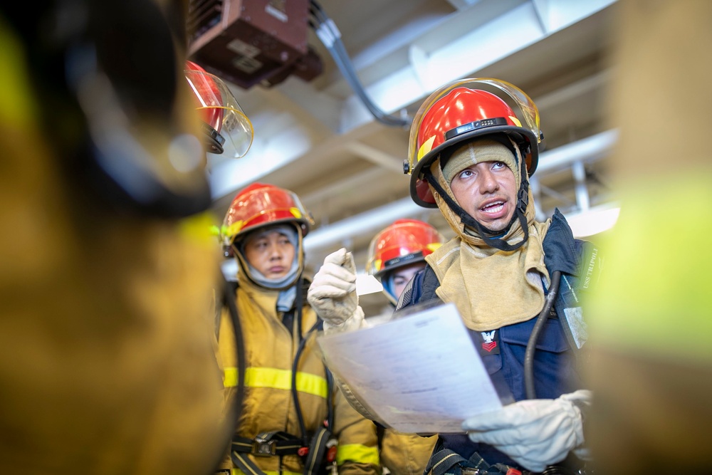 USS Tripoli Conducts Main Space Fire Drill