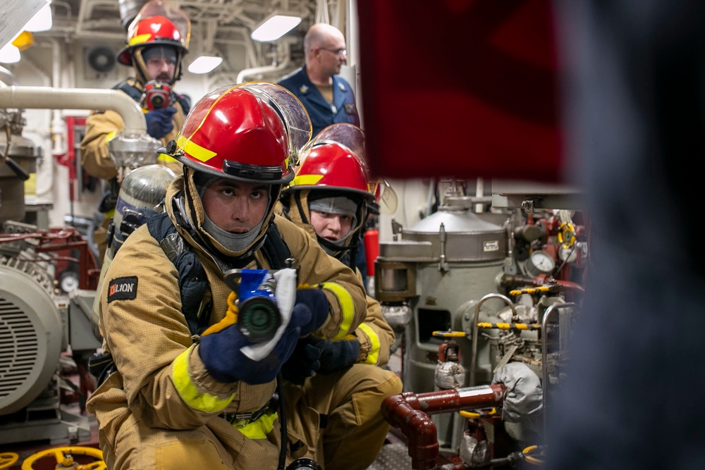 USS Tripoli Conducts Main Space Fire Drill