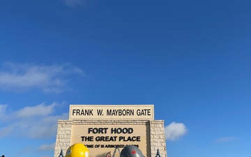 Contractors Inspect Completed Fort Hood Sign