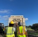 Contractors Inspect Completed Fort Hood Sign