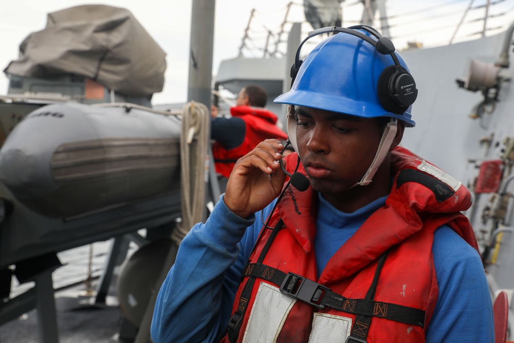 Sailors aboard the USS John Finn conduct a small boat operation in Sagami Wan