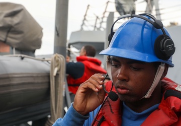 Sailors aboard the USS John Finn conduct a small boat operation in Sagami Wan