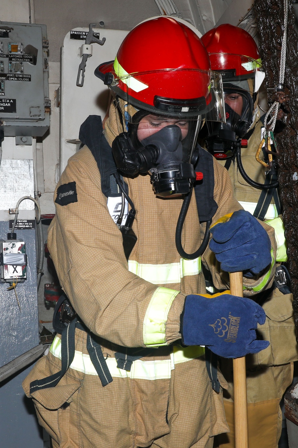 Sailors aboard the USS John Finn conduct a firefighting drill in Sagami Wan