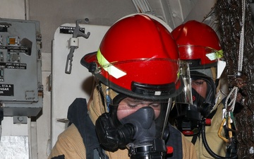 Sailors aboard the USS John Finn conduct a firefighting drill in Sagami Wan