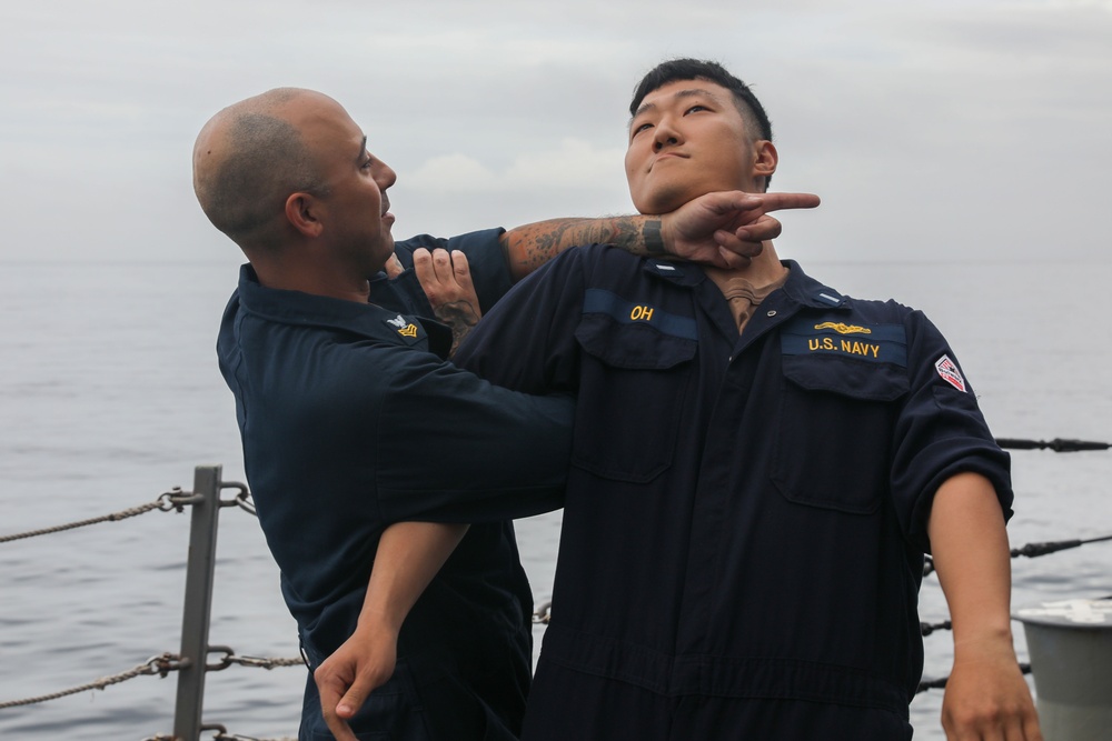 Sailors aboard the USS John Finn conduct a security reaction force class in Sagami Wan