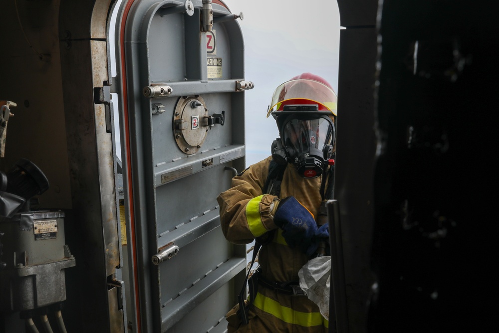 Sailors aboard the USS John Finn conduct a firefighting drill in Sagami Wan