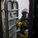 Sailors aboard the USS John Finn conduct a firefighting drill in Sagami Wan