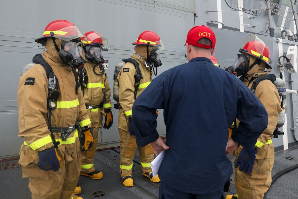 Sailors aboard the USS John Finn conduct a firefighting drill in Sagami Wan
