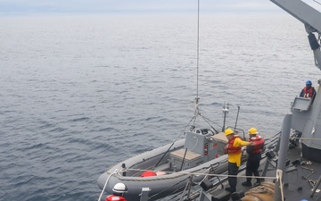 Sailors aboard the USS John Finn conduct a small boat operation in Sagami Wan