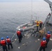 Sailors aboard the USS John Finn conduct a small boat operation in Sagami Wan