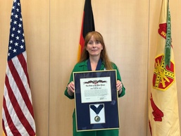 USAG Rheinland-Pfalz presents director with Army’s highest DFMWR award