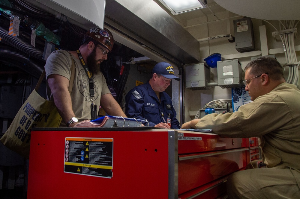 USS Ronald Reagan (CVN 76) Sailors and contractors conduct maintenance.