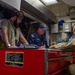 USS Ronald Reagan (CVN 76) Sailors and contractors conduct maintenance.