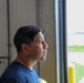 Captain Gregory Cruz listening to his firemen explain operations