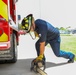 Firefighter Adam Burkholder cranks chainsaw to test operations