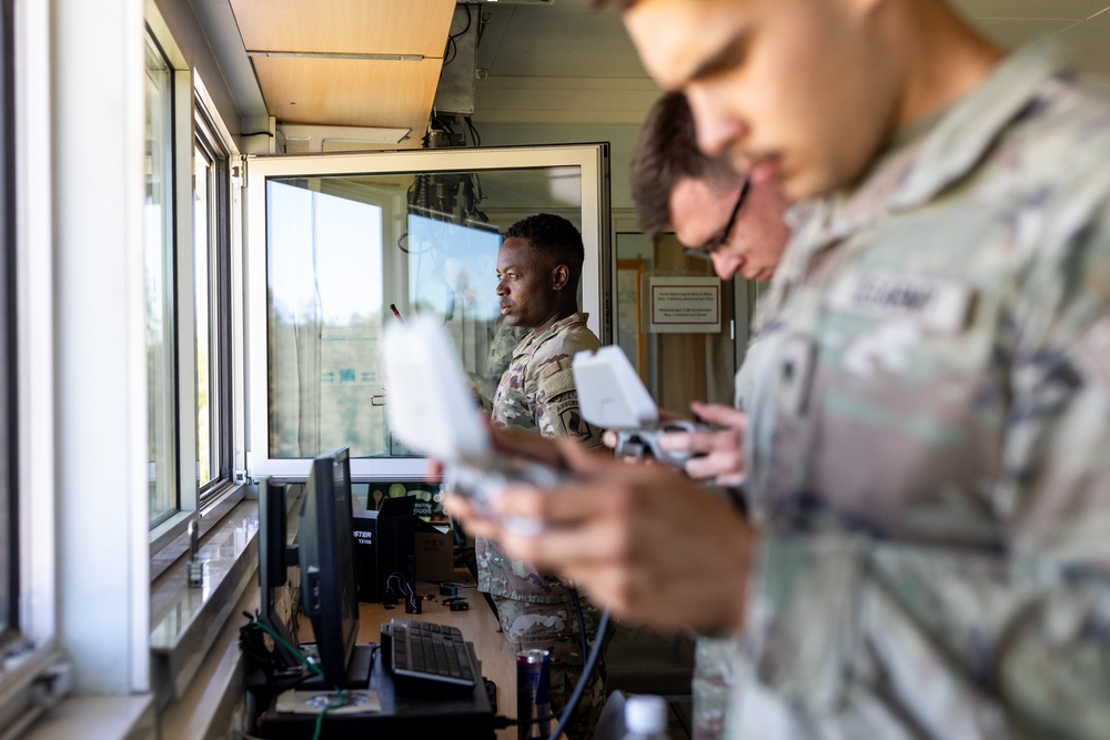 U.S. Soldiers from the 278th Armored Cavalry Regiment and 173rd Airborne Brigade work together.