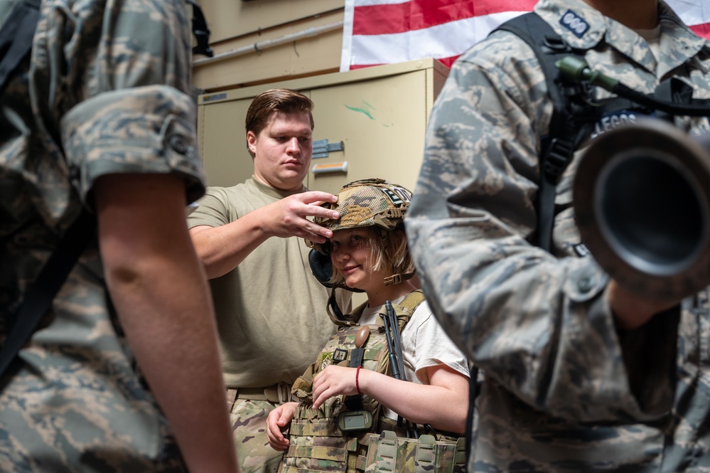 Civil Air Patrol Cadet tries on EOD Bomb Suit