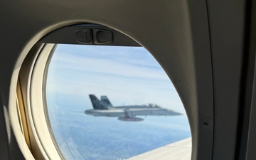 Chief Warrant Officer Circles the Globe in C-12 Huron